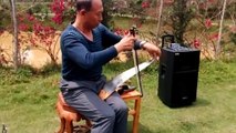 Chinese man uses musical saw to play Japanese ballad