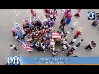 Murid SK Gelugor hasilkan wau Jalur Gemilang terpanjang