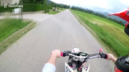 Motorbiker captures heart-stopping moment he ducks under truck