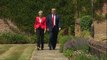 Theresa May and Donald Trump hold hands at Chequers