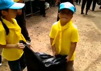 Children Help Clean Up Effort at Thai Cave Rescue Site