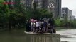 Chengdu suffered from torrential rain on Wednesday. Some pedestrians were stuck on a flooded road. A truck was used transport people to safe places.