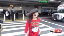 Camila Alves wearing Christmas sweater arriving at LAX Airport in Los Angeles