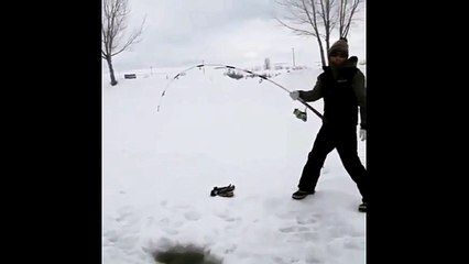 Fishing a Giant Sturgeon Through the Ice