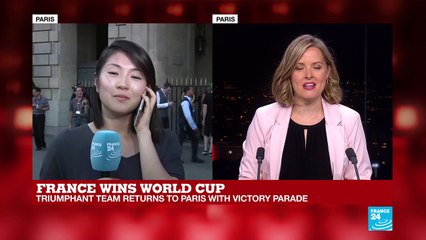 Fans wait for French players at Hotel de Crillon