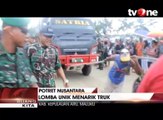 Rayakan HUT TNI, Warga Lomba Menarik Truk