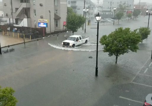 Truck Drives Through Flooded New Jersey Street After Storm