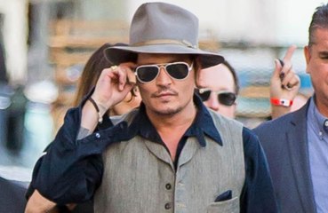 Johnny Depp settles with former managers