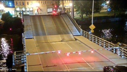 Footage shows cyclist fall into gap of rising bridge