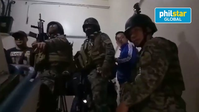 Members of the PNP-CITF conduct an operation inside the Manila Police District headquarters