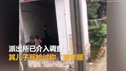 man forces his elderly mother to eat GRASS after she argued with his wife