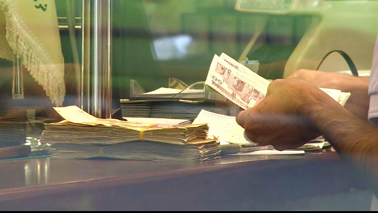 Iran currency halves in less than a year