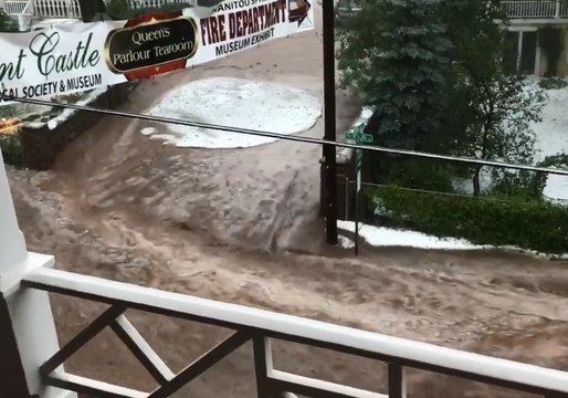 Road Becomes River as Floodwaters Cover Manitou Springs, Colorado