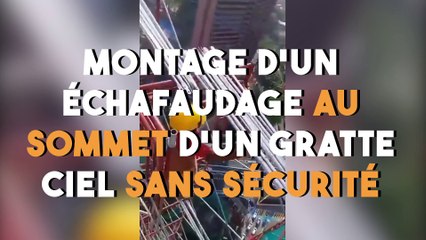Montage d'un échafaudage au sommet d’un gratte ciel sans sécurité !