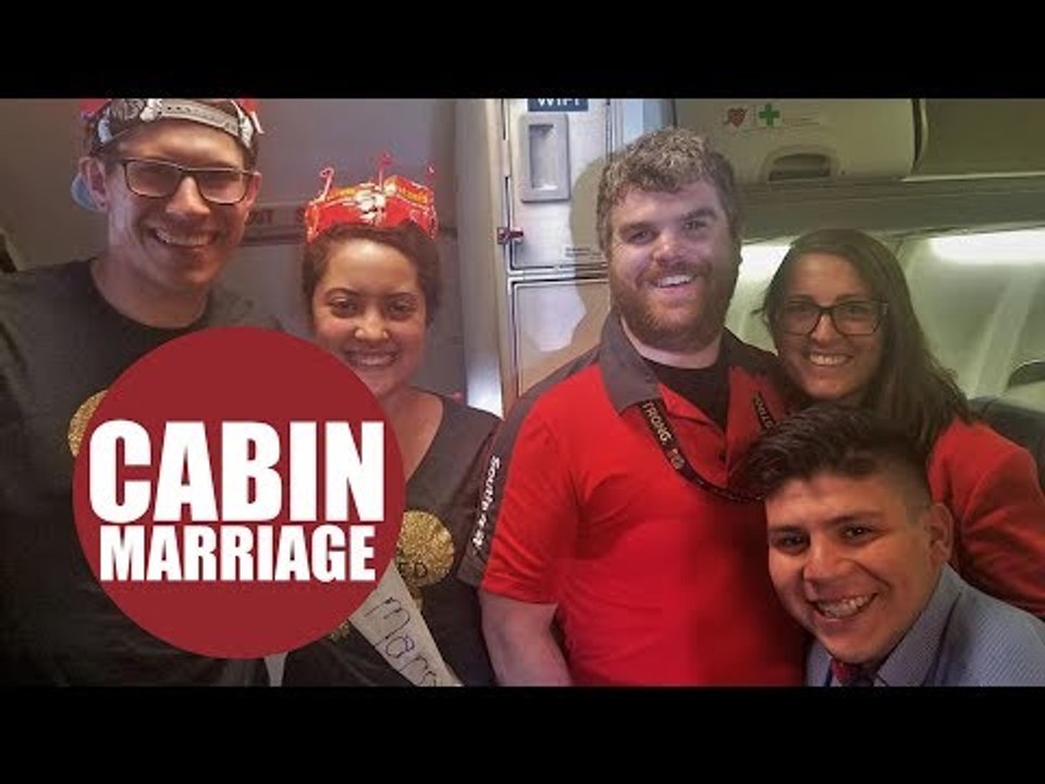 Newlyweds touched when air attendants hold special ceremony mid-flight to celebrate their marriage