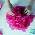 These DIY pom-poms are simple, inexpensive decorations that are perfect for baby showers, birthday parties, and more! Here's how to make them: