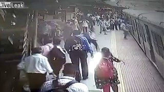 Woman slips under moving train, alert cop saves her