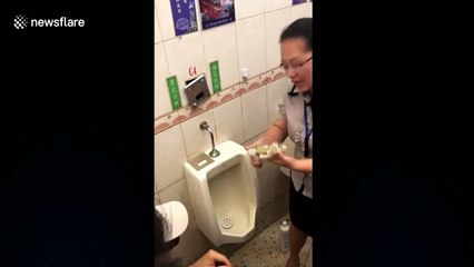 Chinese employee devours food from urinal to prove how clean it is