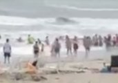 North Carolina Beachgoers Form Human Chain in Attempt to Rescue Swimmer