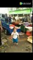 Meanwhile In China:Police clearing illegal shops from footpaths.  This little  boy got angry while police tried to remove his mother's shop