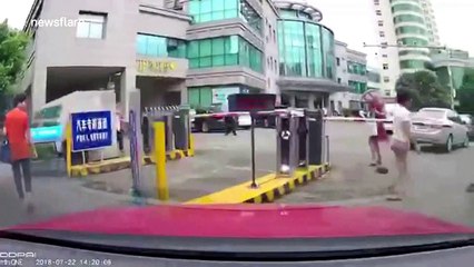 Dashcam captures embarrassing moment boom barrier knocks wig off woman's head