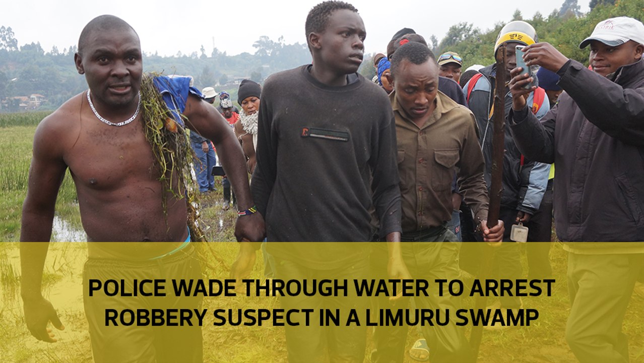Police wade through water to arrest robbery suspect in a Limuru swamp