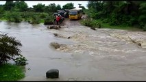 Reckless school bus driver speeds through flooded road