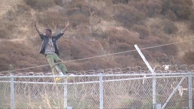 Migrants storm fence at Spain's Ceuta enclave