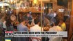 S. Korean President Moon Jae-in enjoys cold beer with Korean people at local pub
