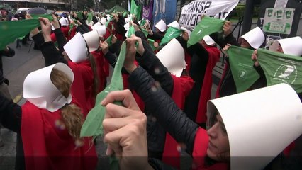 Pro-choice demonstrators dress as handmaids in Argentina