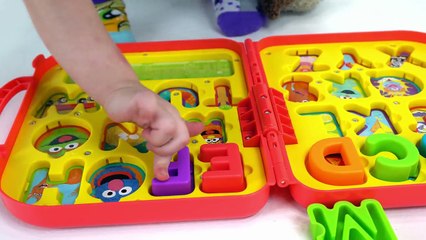 Genevieve Teaches kids Alphabet Sounds with a Toy Puzzle!