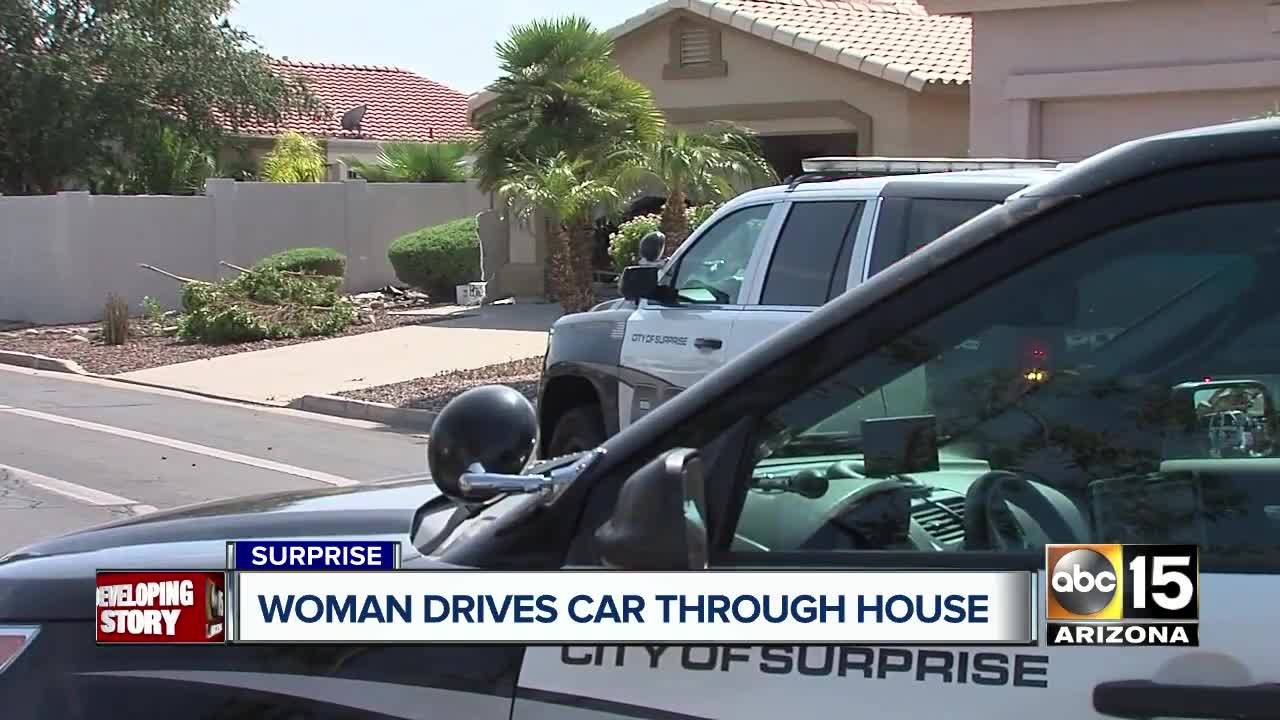 Woman hospitalized after crashing into Surprise home