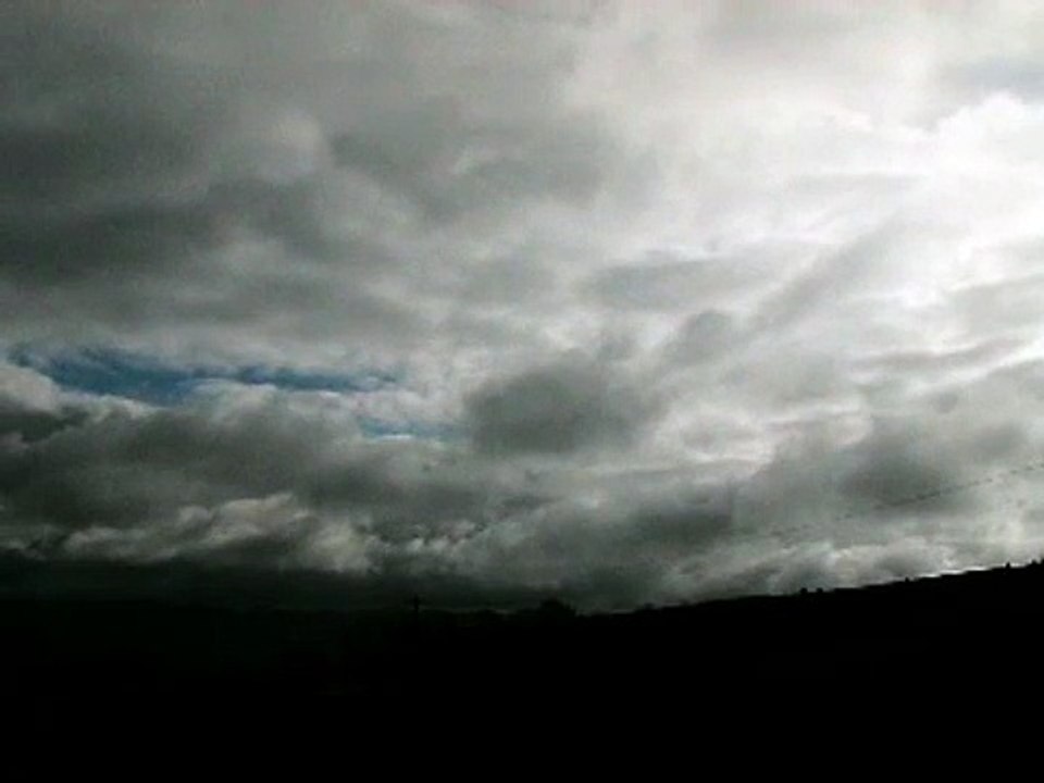 Public clouds, dark clouds rolling across sky