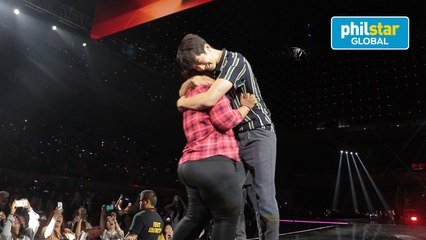 Nam Joo-Hyuk hugs his female fans onstage during acting game