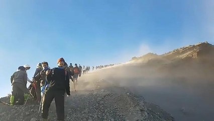 Hundreds of trekkers head down side of volcano after earthquake struck
