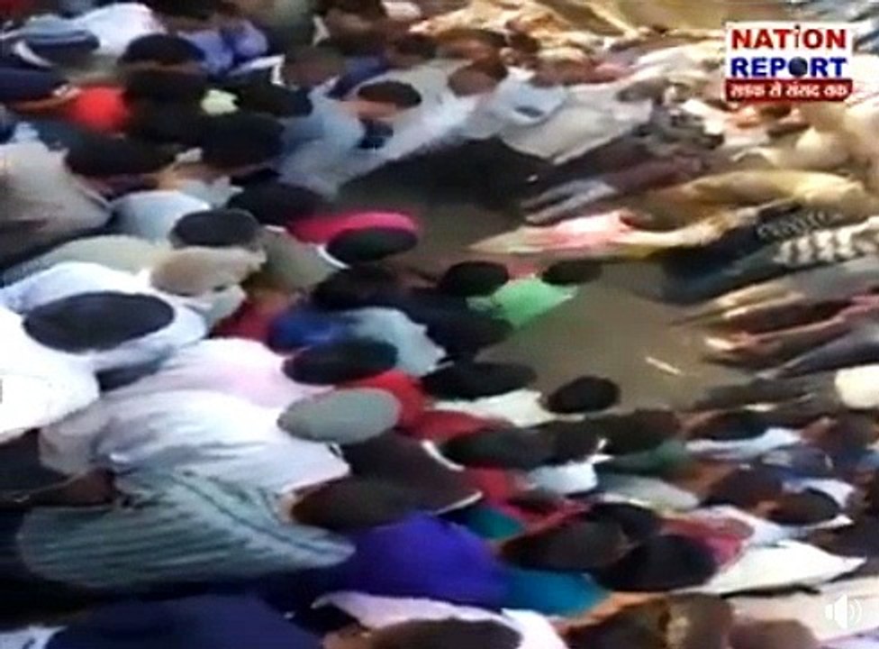 man is beating lady badly in crowd