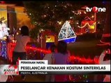 Serunya Bermain Selancar dengan Kostum Sinterklas