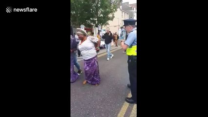 Funny scene as Irish police dances with Africa Day attendees