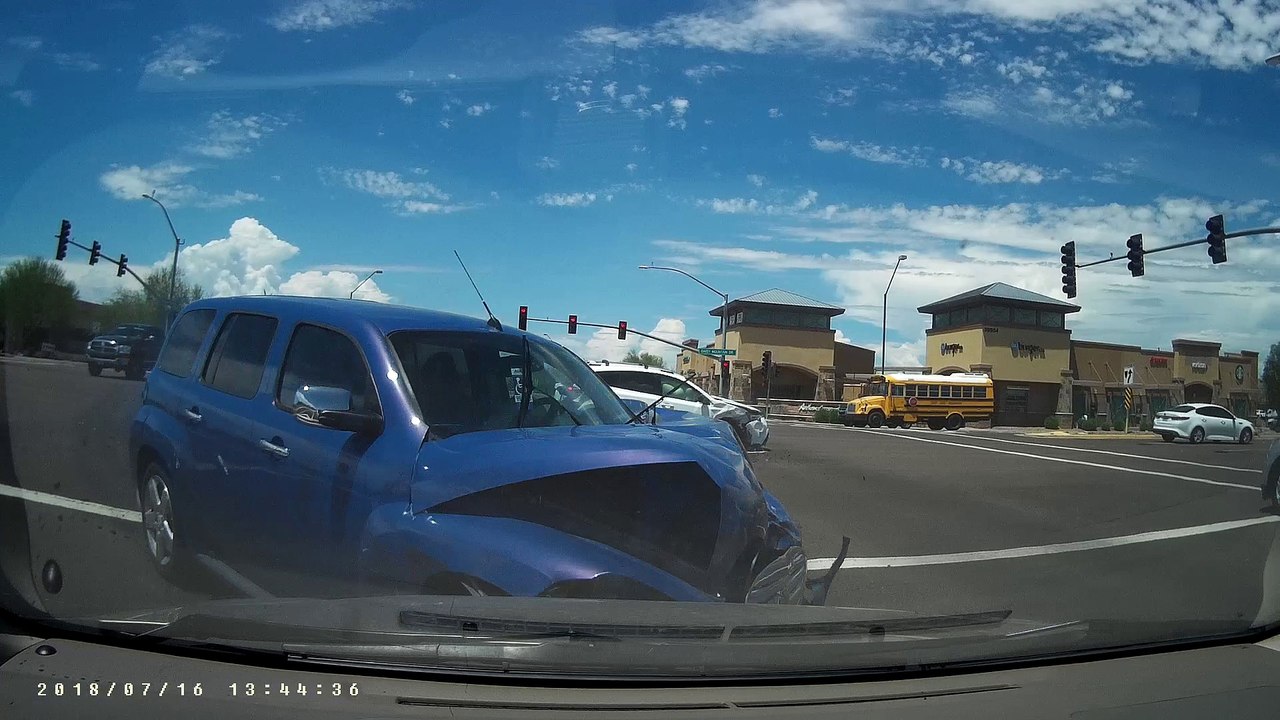 Car Runs Red Light Causing Intersection Accident
