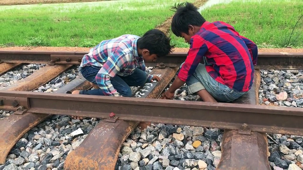 Unbelievable ! Brave Brothers Catch Python Snake On The Road While Driving On The Rail Way