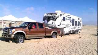 new f350 helping a new f350 and toy hauler Pismo