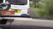 This video shows a race between two public transport operators recorded by a passenger in the front seat of one of the minivans.  Reckless or skilled drivers?