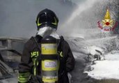 Italian Firefighters Hose Down Vehicles, Structures on Fire from Bologna Highway Explosion