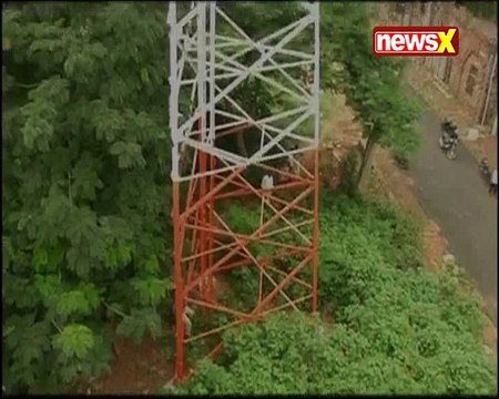 Tension prevails at Vishakhapatnam's collector office as a mother climbed on a Cell Tower