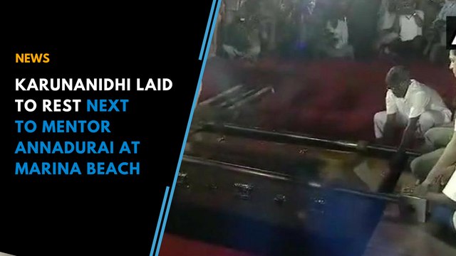 Karunanidhi laid to rest next to mentor Annadurai at Marina Beach