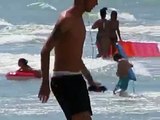 Children swimming at the beach pool - kids playing at the beach - beach game