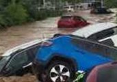 Raging Floods Wash Away Cars From New Jersey Dealership