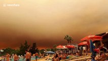 Looks like a holiday of horror! Tourists shocked by huge cloud of smoke filling the sky