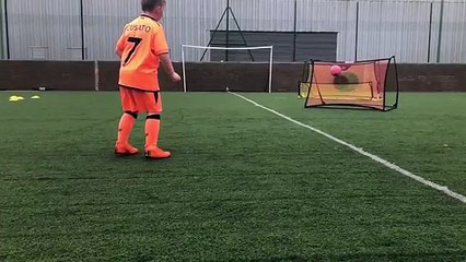 7 Year old doing a football drill in slow motion