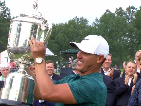 Koepka keeps Woods at arms length to win PGA